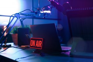 Live online radio broadcasting station desk with on air sign